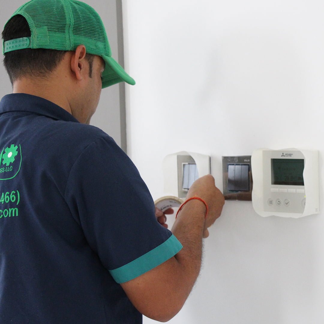 Primo Home Services AC Technician at work in Emirates Hills Dubai
